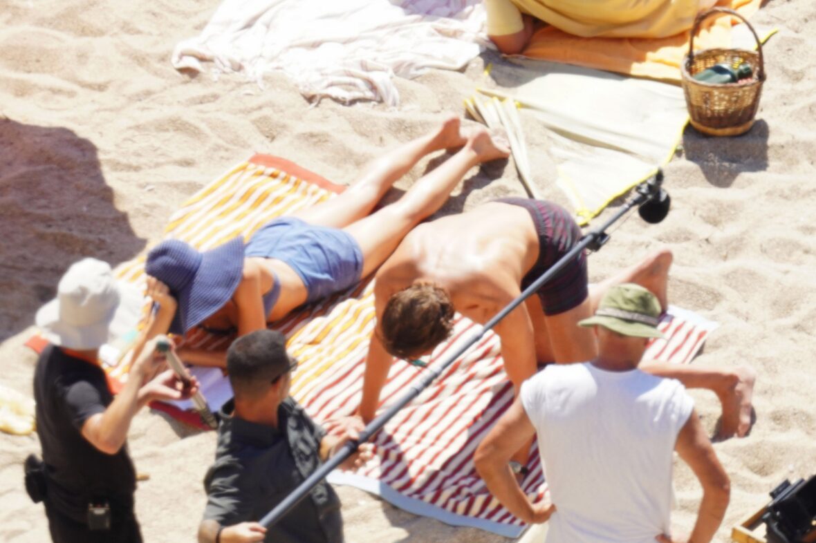 Margot Robbie and Bradley Cooper in swimsuits on beach for Ocean's Eleven prequel movie