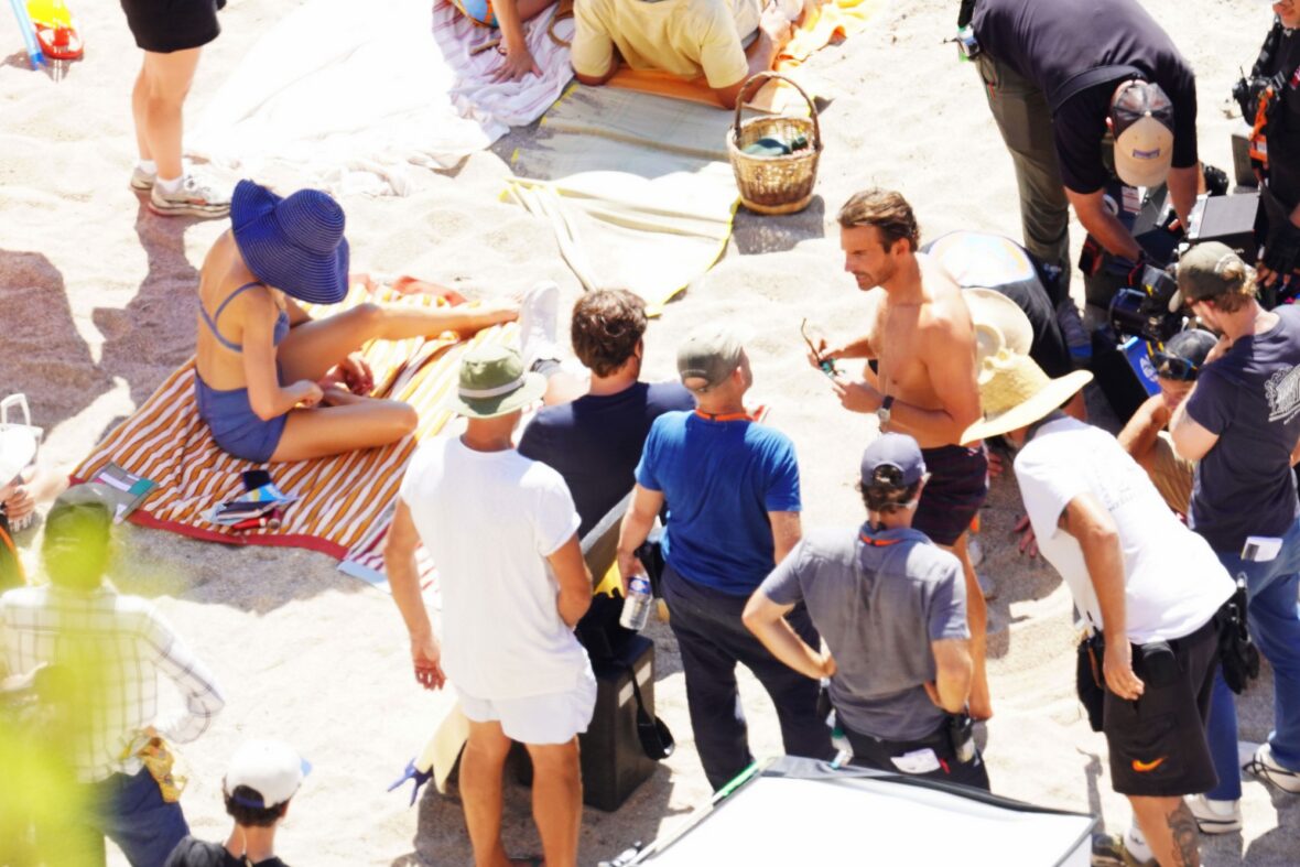 Margot Robbie and Bradley Cooper in swimsuits on beach for Ocean's Eleven prequel movie