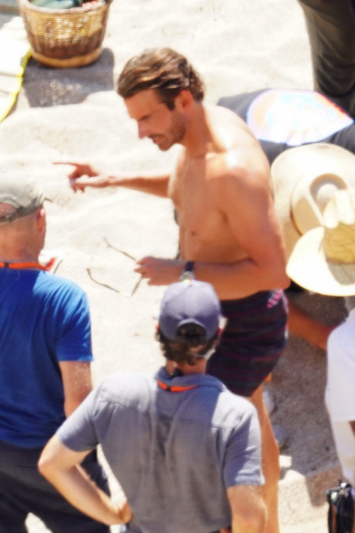 Margot Robbie and Bradley Cooper in swimsuits on beach for Ocean's Eleven prequel movie