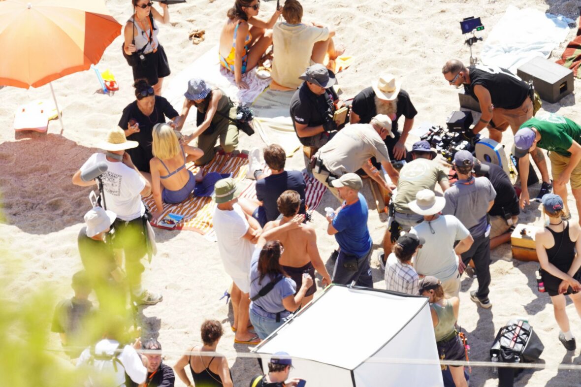 Margot Robbie and Bradley Cooper in swimsuits on beach for Ocean's Eleven prequel movie