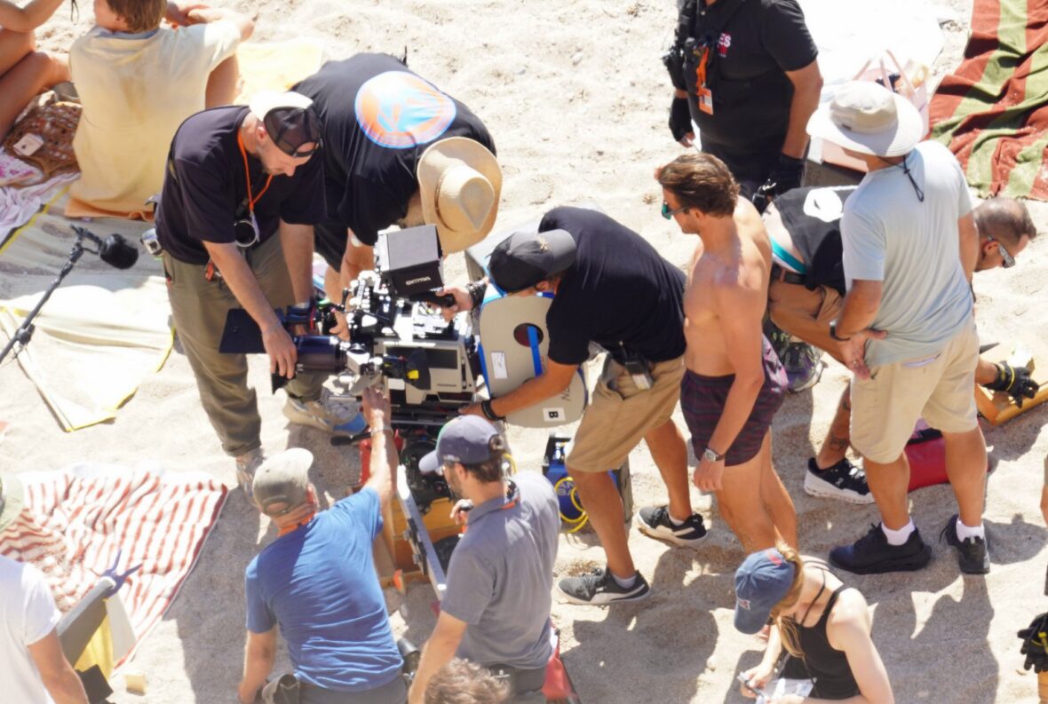 Margot Robbie and Bradley Cooper in swimsuits on beach for Ocean's Eleven prequel movie