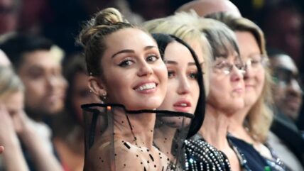 Miley and Noah Cyrus sitting together