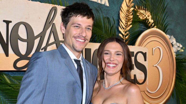 Millie Bobby Brown and Jake Bongiovi pose at the Enola Holmes 3 premiere