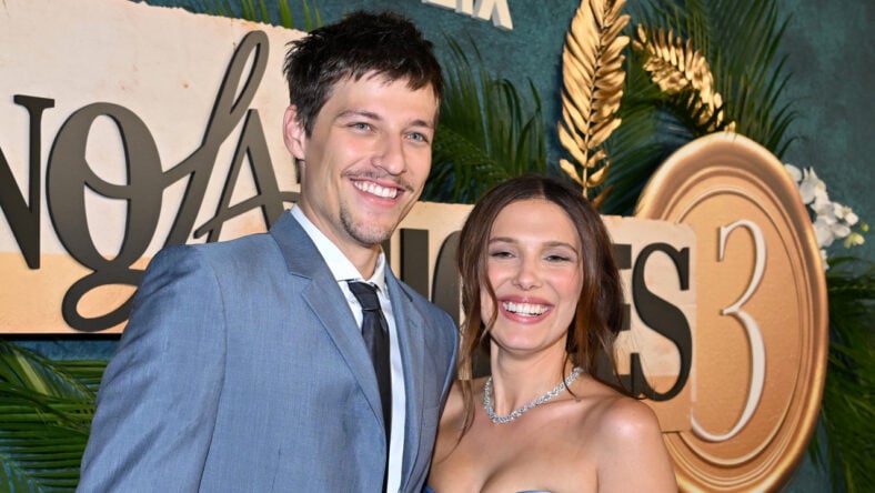 Millie Bobby Brown and Jake Bongiovi pose at the Enola Holmes 3 premiere