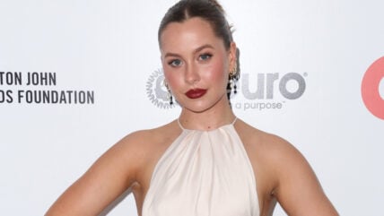 Natasha Bure in a white halter dress.
