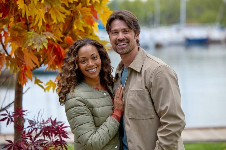 Mishael Morgan and Corey Sevier take a photo together behind the scenes of Pumpkin Regatta Romance.