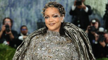 Rihanna smiles for photos at the Met Gala