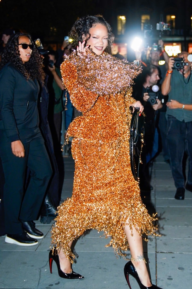 Rihanna in a gold embellished skirt suit.