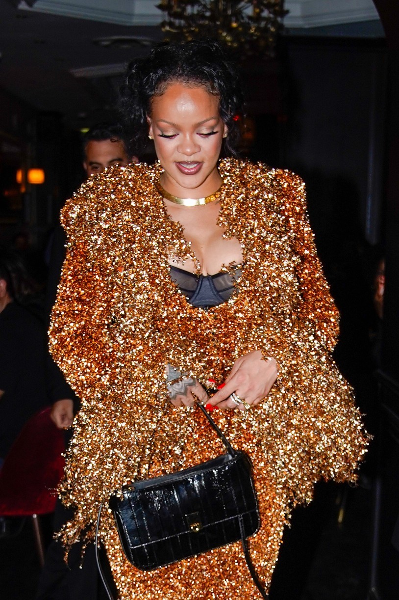 Rihanna in a gold embellished skirt suit.