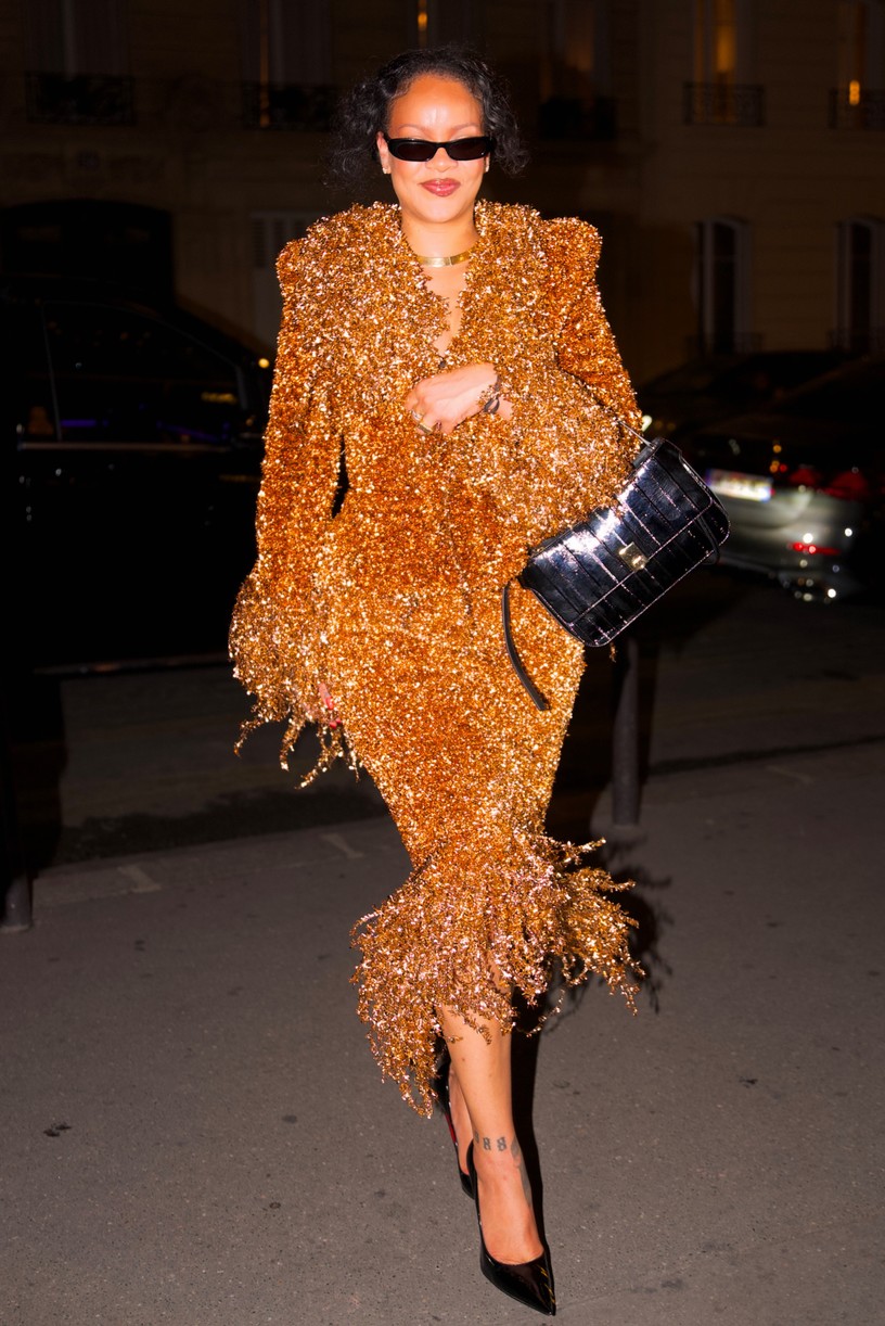 Rihanna in a gold embellished skirt suit.
