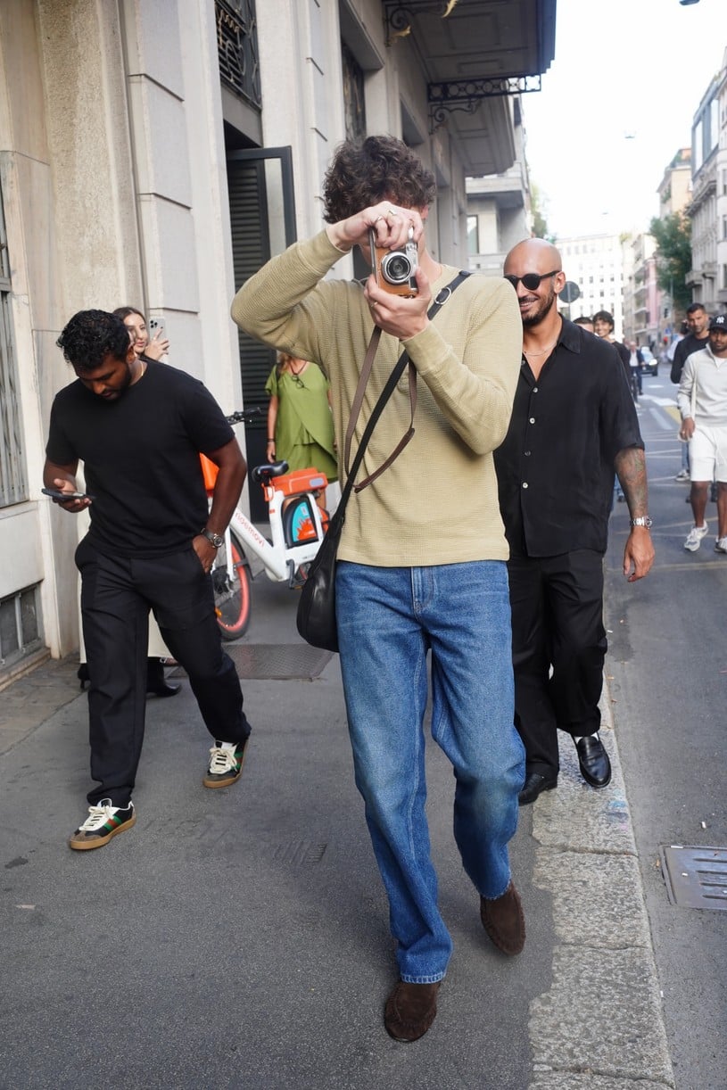 Shawn Mendes in a long-sleeve top with a camera in Milan.
