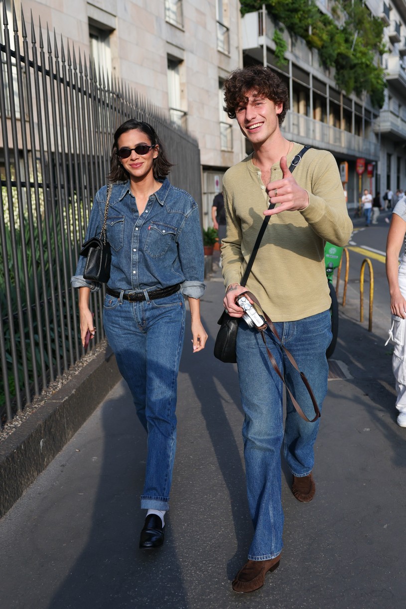 Shawn Mendes in a long-sleeve top with a camera in Milan alongside girlfriend Bruna Marquezine who is dressed in all denim.