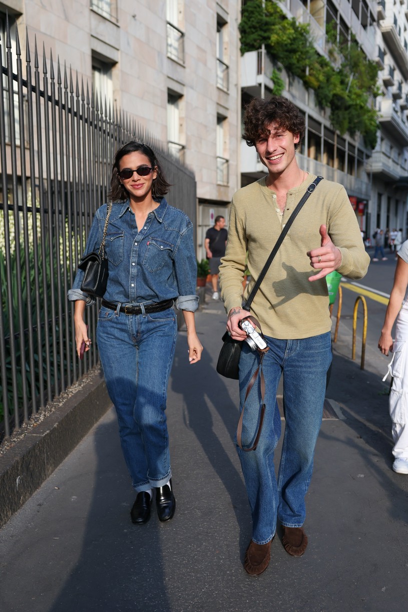 Shawn Mendes in a long-sleeve top with a camera in Milan alongside girlfriend Bruna Marquezine who is dressed in all denim.