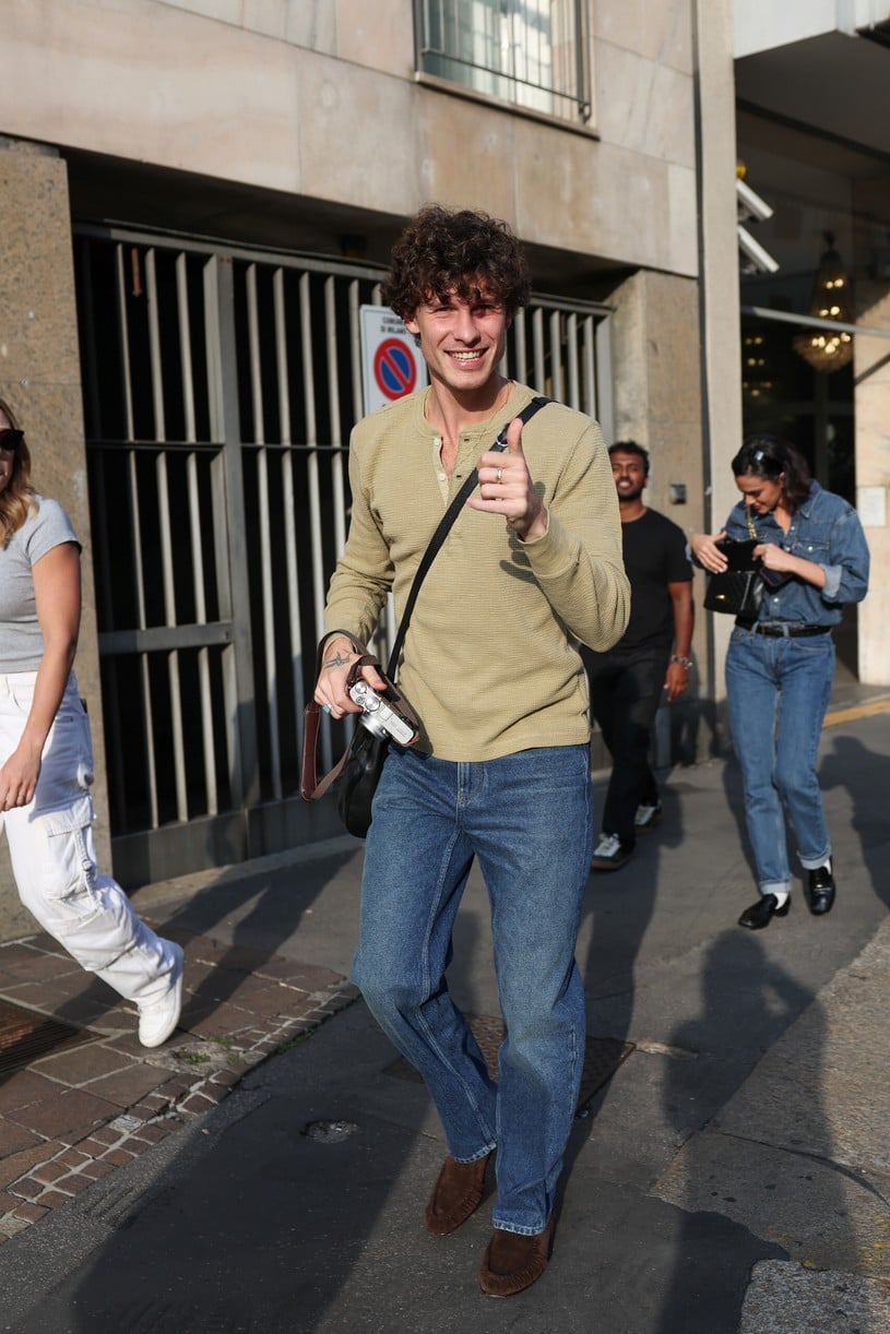 Shawn Mendes in a long-sleeve top with a camera in Milan.