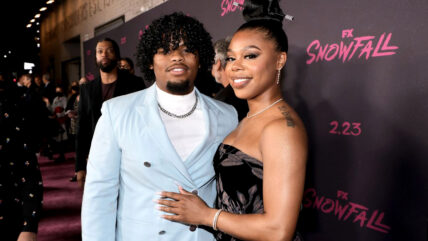 Isaiah John and Gail Bean pose together at Snowfall event.