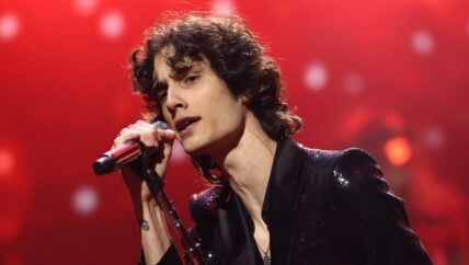 Sombr performing with microphone