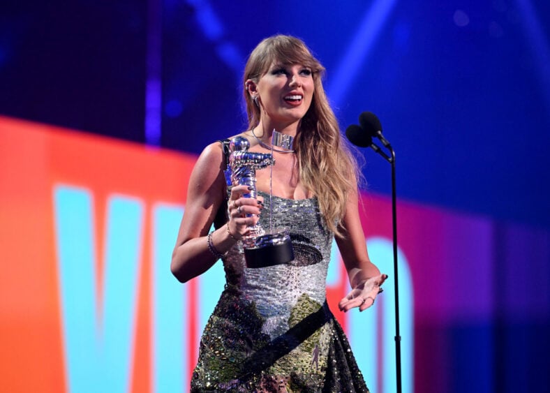 Taylor swift accepting a Moon Man at the VMAs in a past appearance