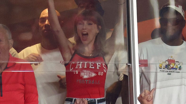 Taylor Swift in red Chiefs tank top at game