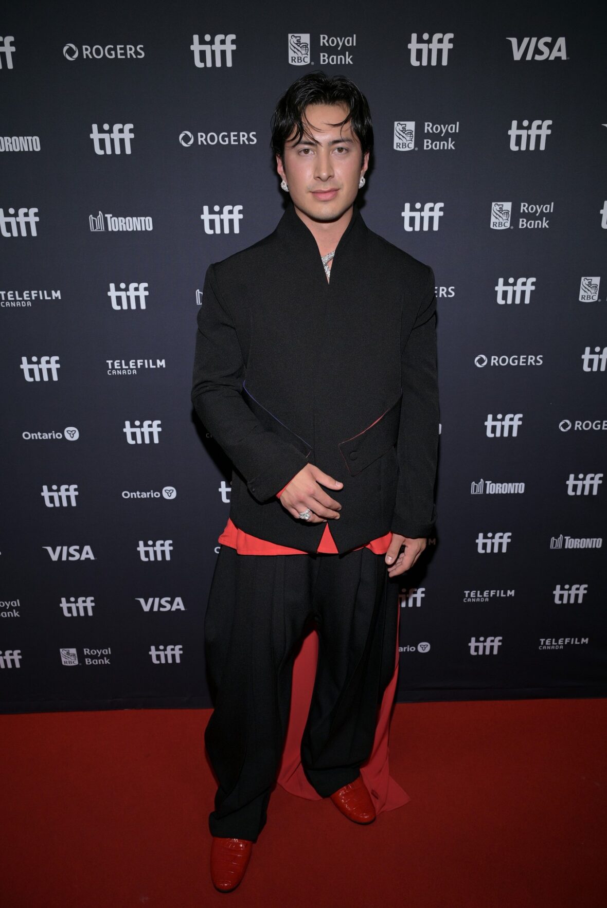 Hudson Williams poses at the TIFF premiere of his new series Yaga