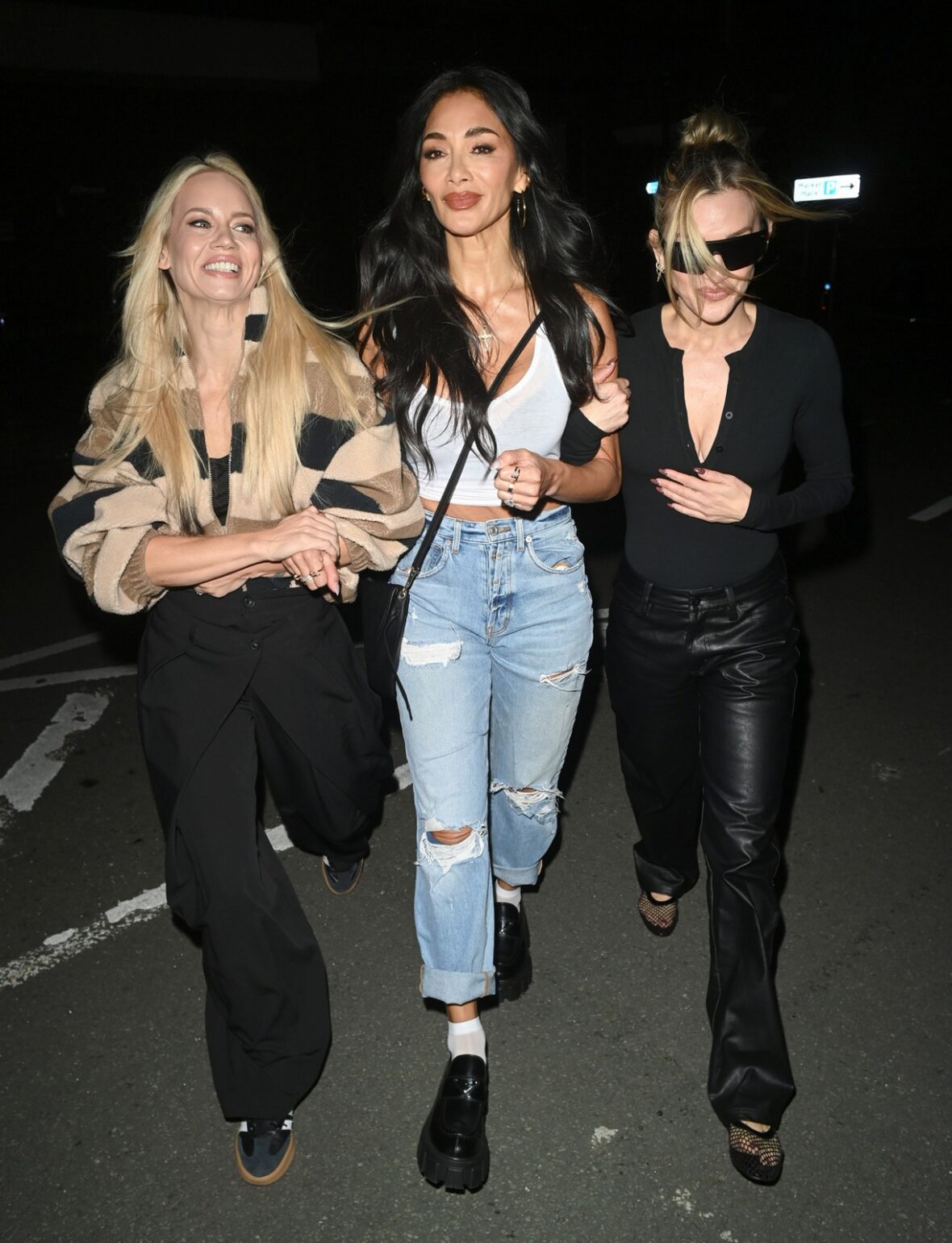 Pussycat Dolls members Nicole Scherzinger, Ashley Roberts, and Kimberly Wyatt enjoyed a night on the town in Manchester on Thursday.