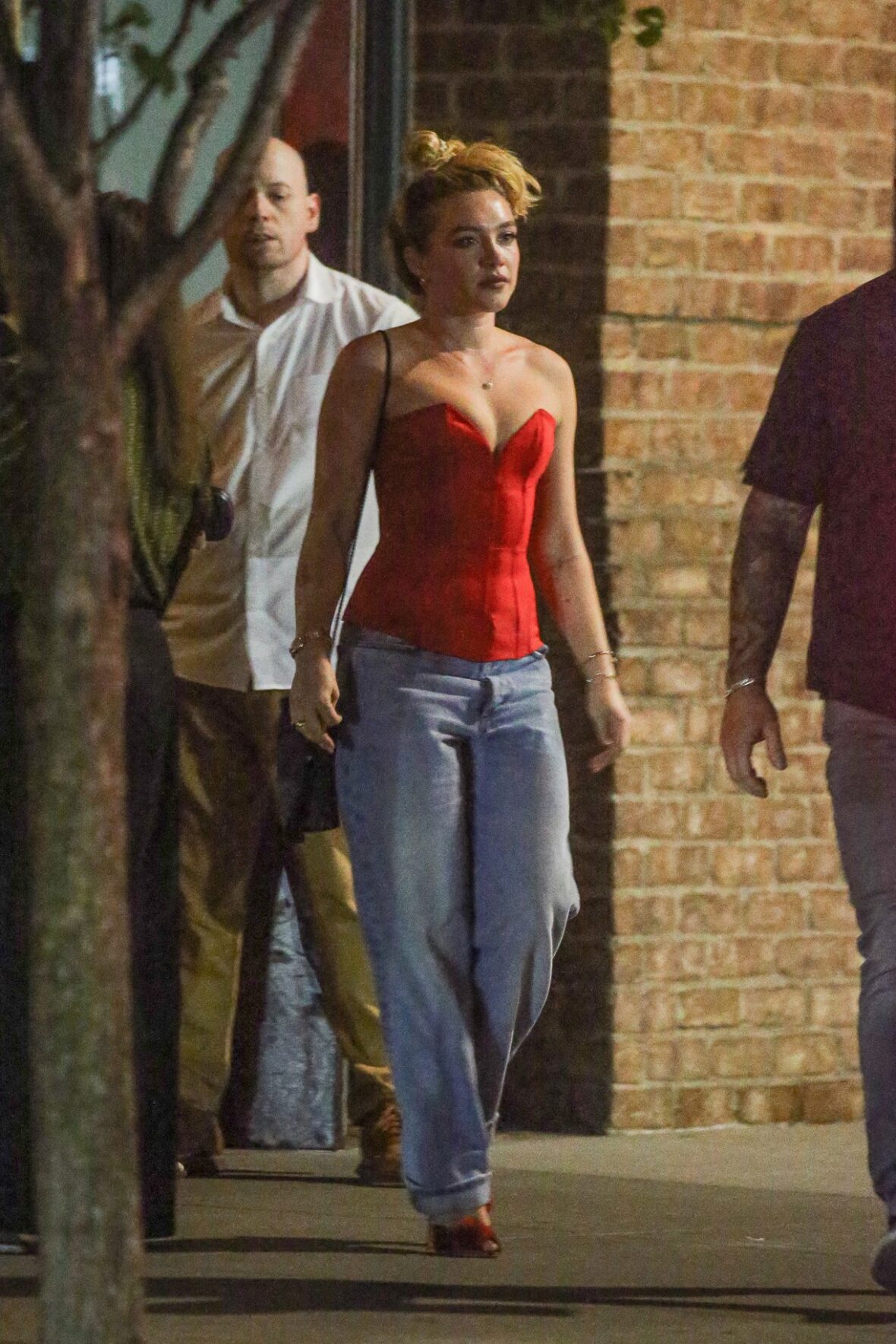 Florence Pugh has been promoting her new series East of Eden in New York City. On the day of its release, she was seen shopping with boyfriend Finn Cole and later stepping out for dinner in a red corset top.