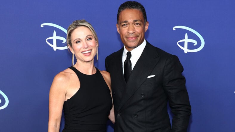 Amy Robach and T.J. Holmes wear black formalwear while attending the 2022 ABC Disney Upfront.
