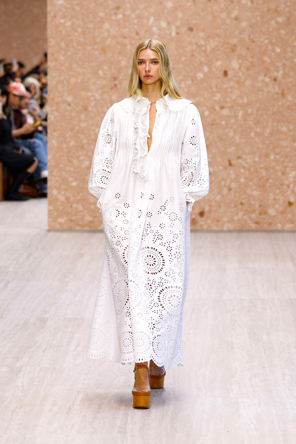 Apple Martin wears a romantic white dress to walk the runway at Chloé Spring/Summer 2027 show during Paris Fashion Week.