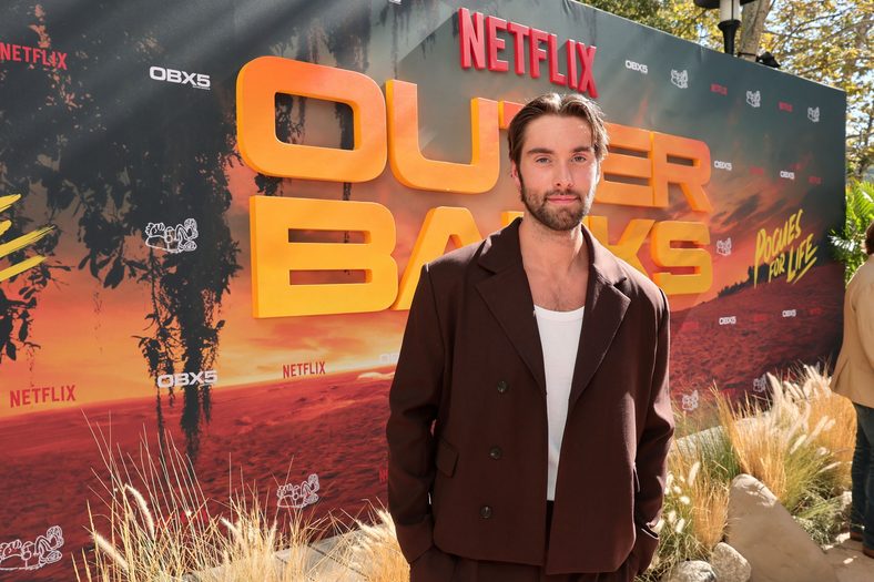 Austin North poses at Outer Banks season 5 premiere