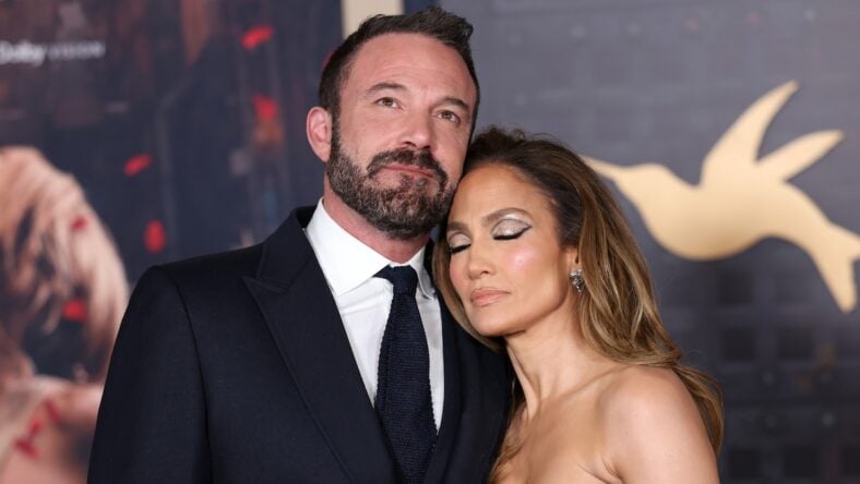 Ben Affleck and Jennifer Lopez embracing on red carpet
