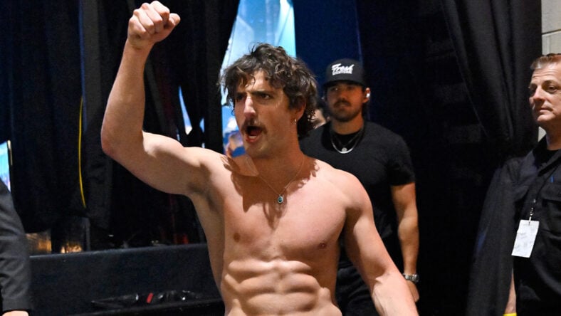 Benson Boone shirtless backstage at concert
