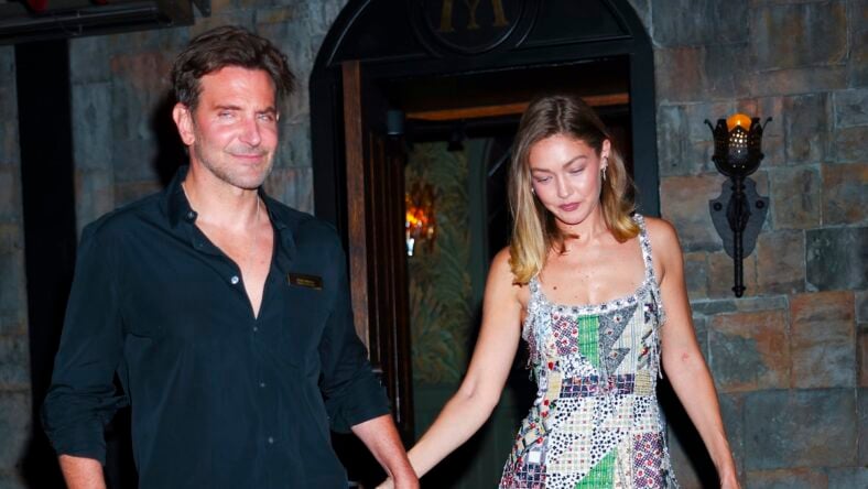 Bradley COoper and gigi hadid holding hands