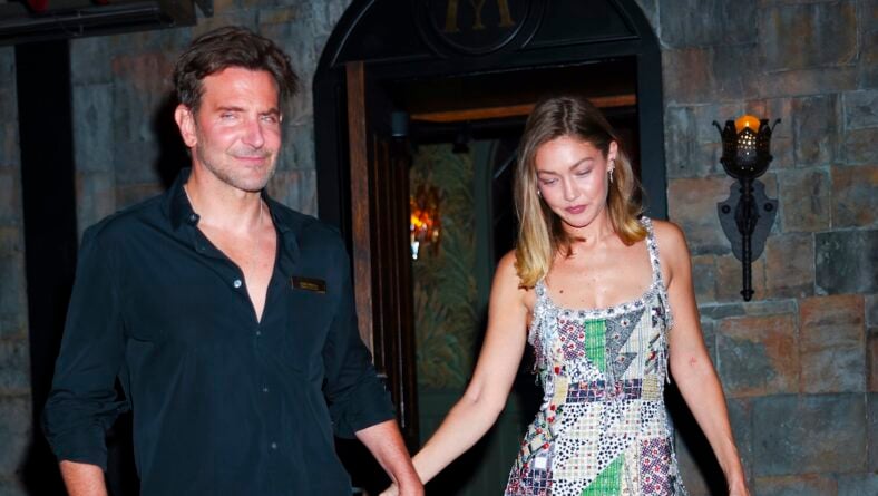 Bradley COoper and gigi hadid holding hands