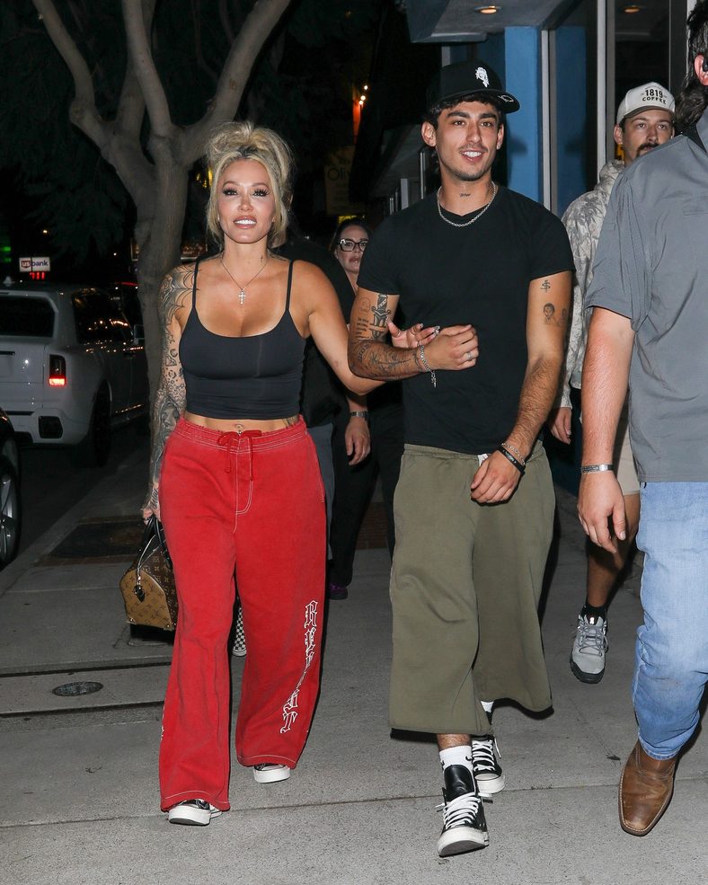 Bunnie XO and Dylan Wolf link arms while arriving for dinner in Sherman Oaks