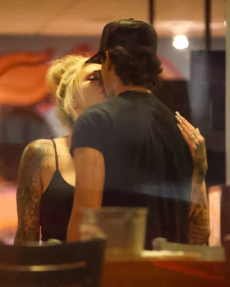 Bunnie XO and Dylan Wolf share a kiss at dinner in Sherman Oaks