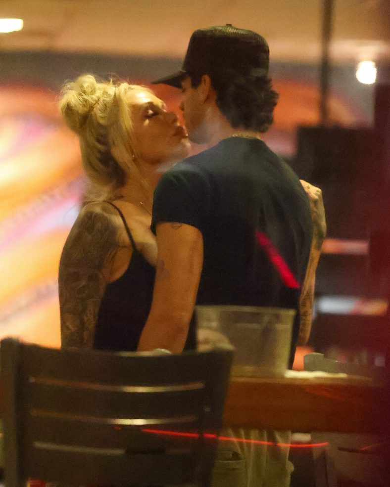 Bunnie XO and Dylan Wolf share a kiss at dinner in Sherman Oaks