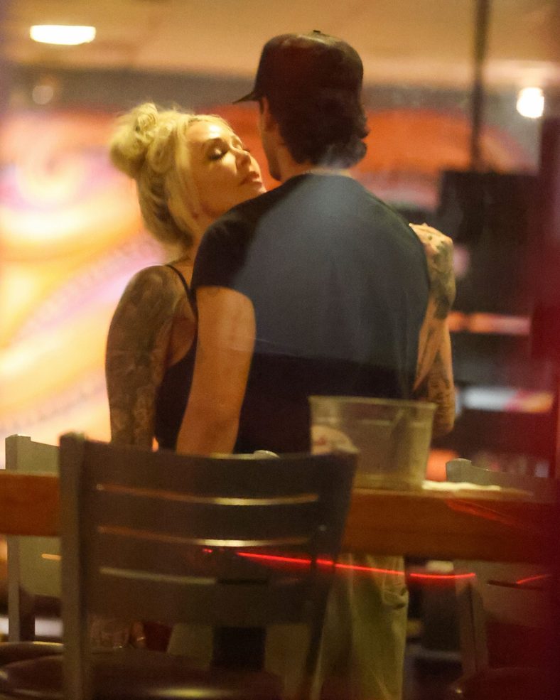Bunnie XO and Dylan Wolf share a kiss at dinner in Sherman Oaks