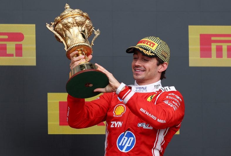 Charles Leclerc holds his trophy after winning British Grand Prix at Silverstone