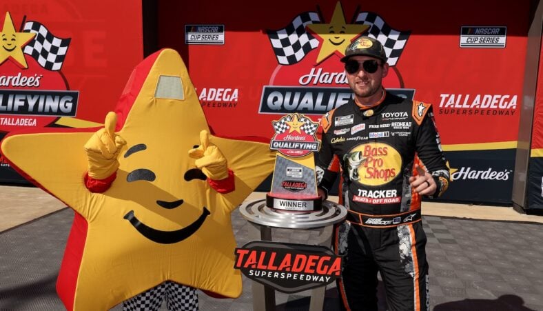 Chase Briscoe, driver of the #19 Bass Pro Shops Toyota, poses for photos after winning the pole award during qualifying for the NASCAR Cup Series YellaWood 500 at Talladega Superspeedway on October 24, 2026 in Talladega, Alabama