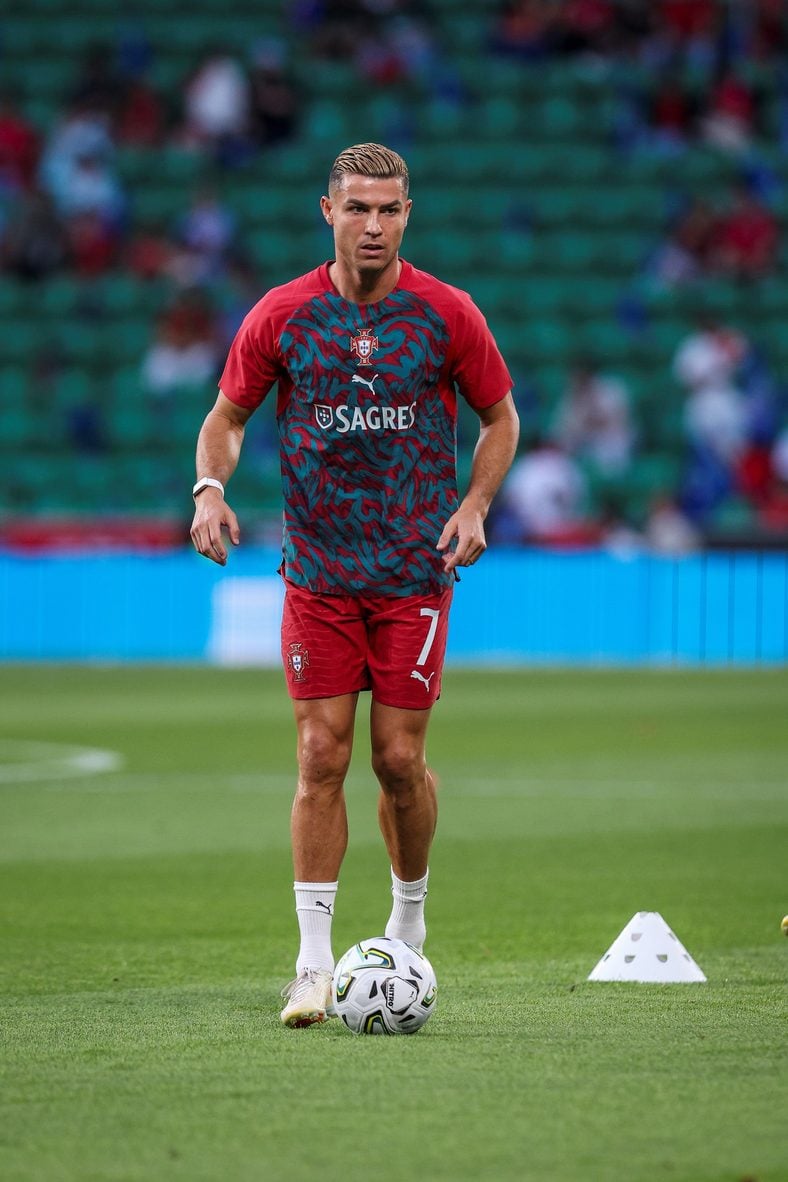 Cristiano Ronaldo warms up on the soccer field