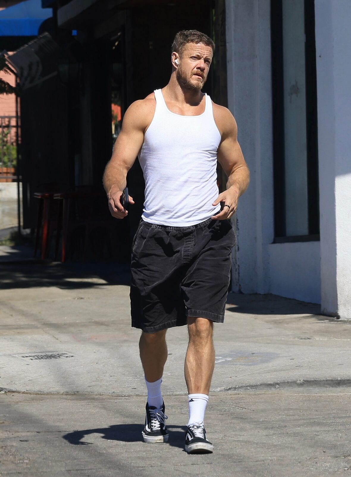 Dan Reynolds runs errands in a tank top