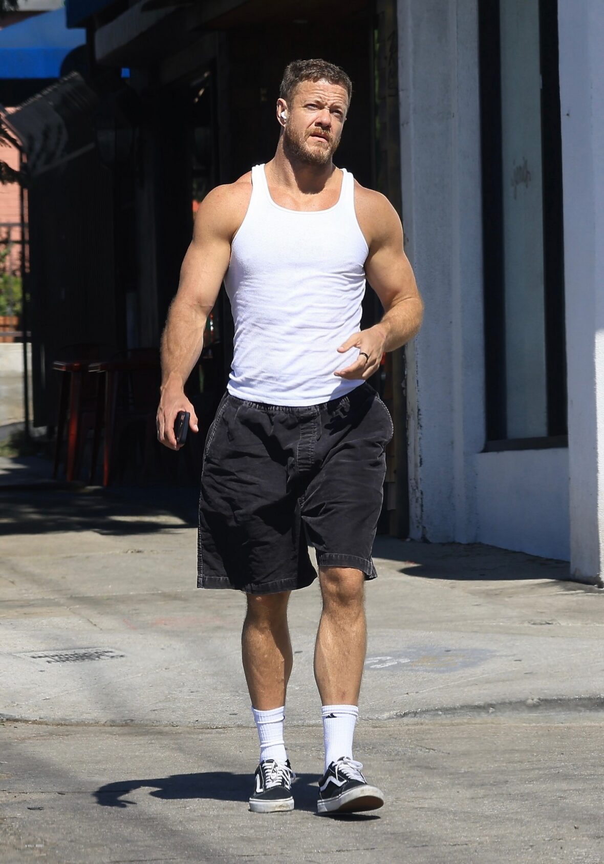 Dan Reynolds runs errands in a tank top