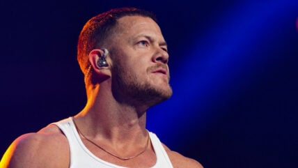 Dan Reynolds in tank top on stage