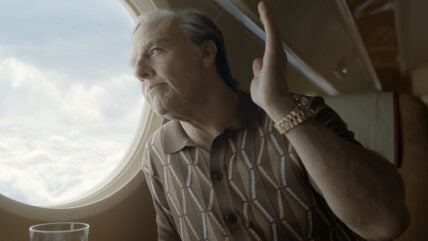 Tom Cruise on an airplane in a still from Digger.