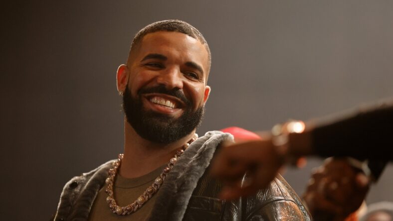Drake smiling looking over shoulder
