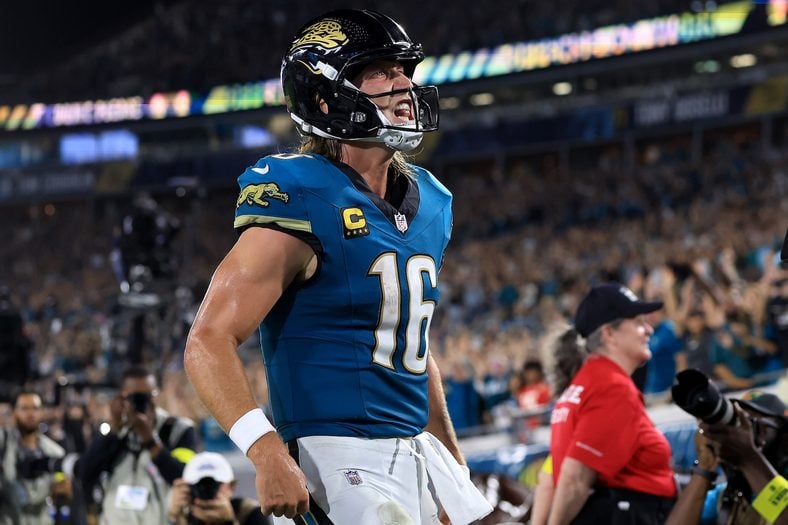 Trevor Lawrence #16 of the Jacksonville Jaguars celebrates a touchdown against the Kansas City Chiefs during the third quarter at EverBank Stadium on October 06