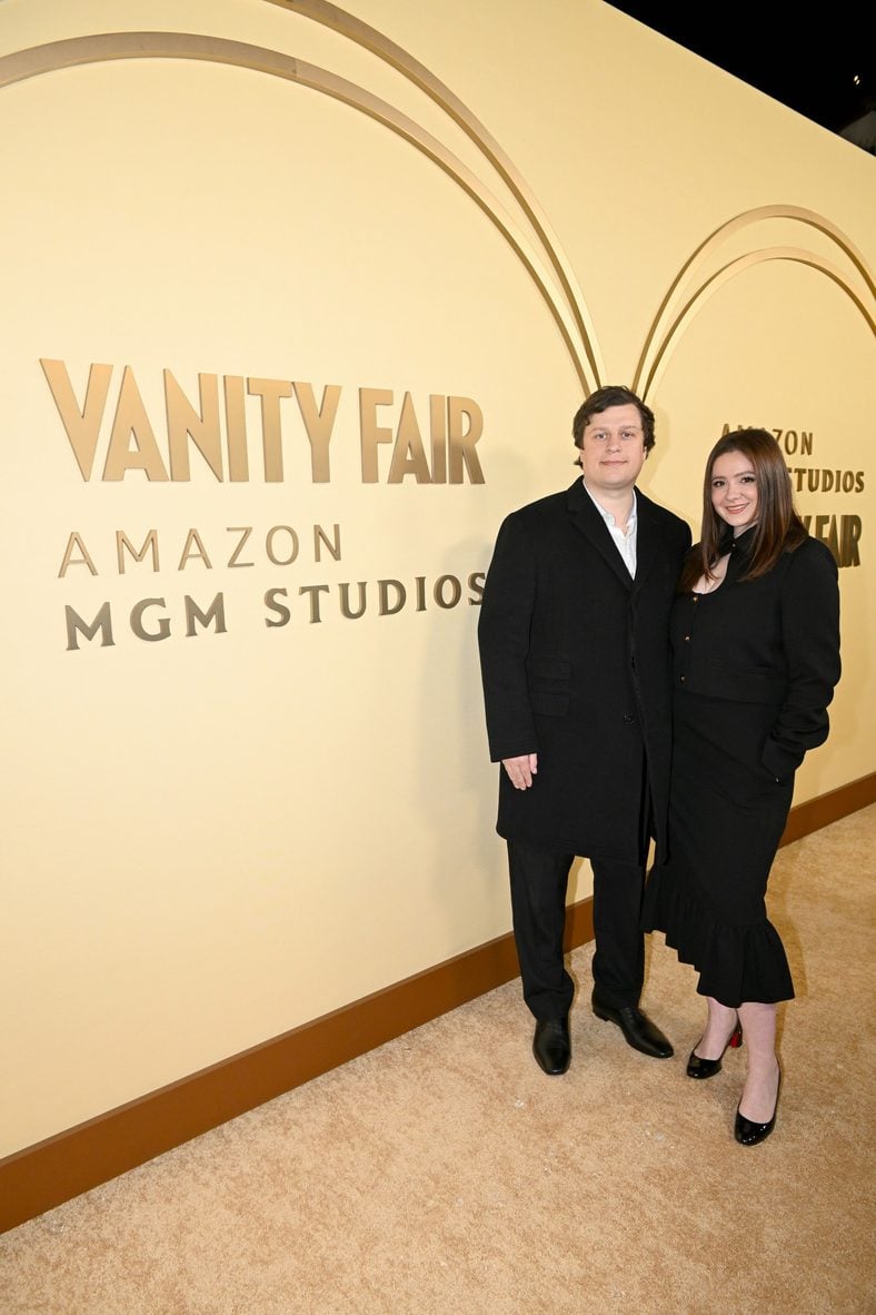 Emma Kenney and Conrad Hilton pose at the Vanity Fair And Amazon MGM Studios Celebrate Awards Season 2026 event