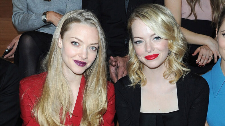 Amanda Seyfried and Emma Stone at a fashion show for Miu Miu