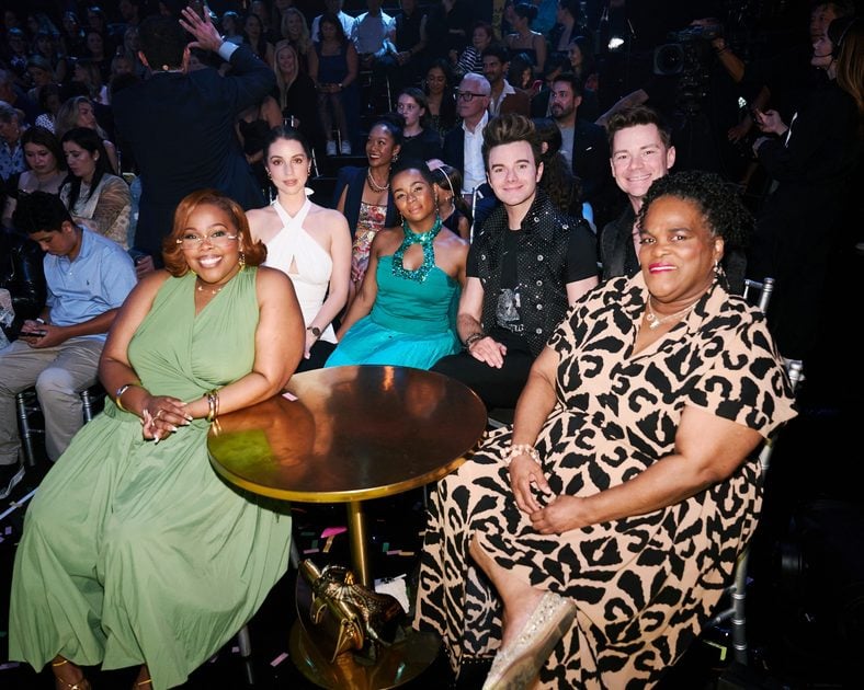 Amber Riley, Adelaide Kane, Alexis Floyd, and Chris Colfer sit in the audience at Dancing with the Stars
