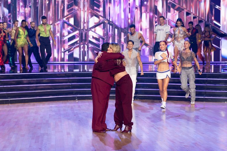 Guillermo Rodriguez and Witney Carson share a hug on stage at DWTS 