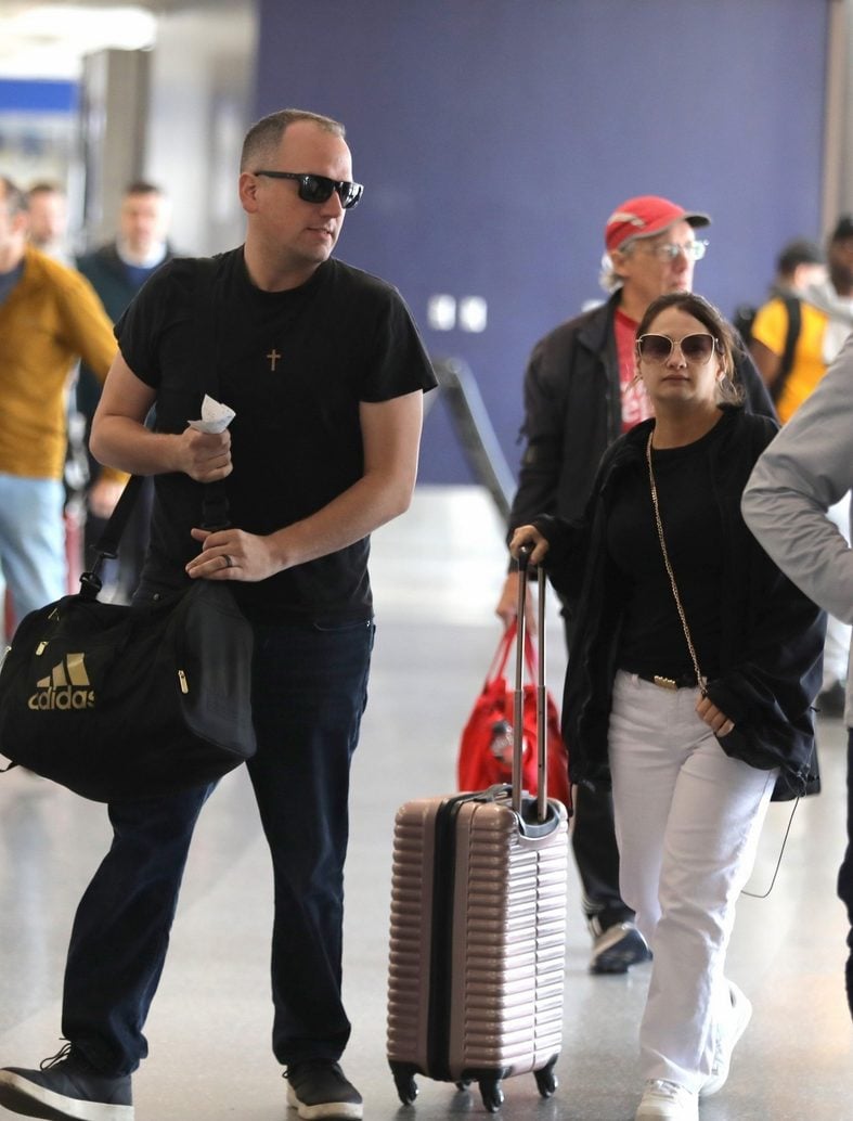 Ken Urker and Gypsy Rose Blanchard walk through the airport